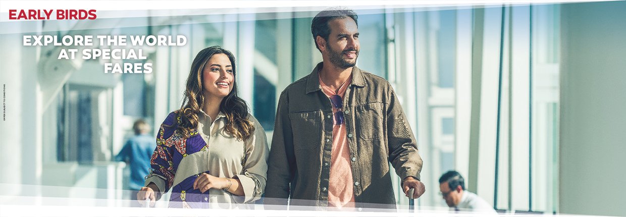 Travellers walking through an airport terminal